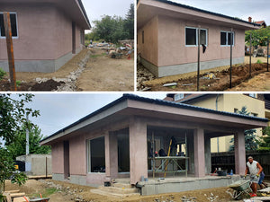 Applying Adhesive and Spackle to a House with a Metal Structure on the Ground Floor thumbnail