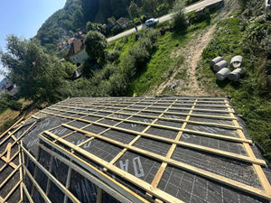 Application of Anti-Condensation Film and Wooden Soffit Cladding for the Roof of a Metal House thumbnail