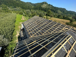 Application of Anti-Condensation Film and Wooden Soffit Cladding for the Roof of a Metal House thumbnail