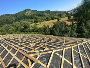 Application of Anti-Condensation Film and Wooden Soffit Cladding for the Roof of a Metal House thumbnail