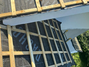 Application of Anti-Condensation Film and Wooden Soffit Cladding for the Roof of a Metal House thumbnail