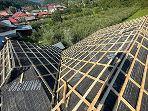 Application of Anti-Condensation Film and Wooden Soffit Cladding for the Roof of a Metal House thumbnail