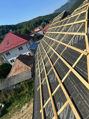 Application of Anti-Condensation Film and Wooden Soffit Cladding for the Roof of a Metal House thumbnail