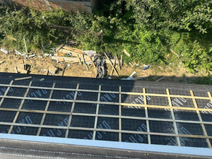 Application of Anti-Condensation Film and Wooden Soffit Cladding for the Roof of a Metal House thumbnail