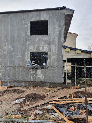 Applying Spackle in 2 Layers to the Facades of a Metal House thumbnail