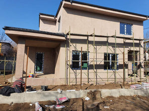 Applying Spackle in 2 Layers to the Facades of a Metal House thumbnail