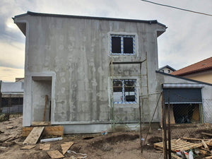Applying Spackle in 2 Layers to the Facades of a Metal House thumbnail