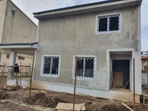 Applying Spackle in 2 Layers to the Facades of a Metal House thumbnail