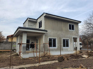 Applying Spackle in 2 Layers to the Facades of a Metal House thumbnail