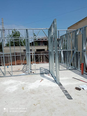 Under-Construction House with Installation of Metal Frame Wall Panels thumbnail