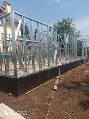 Under-Construction House with Installation of Metal Frame Wall Panels thumbnail