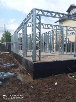 Under-Construction House with Installation of Metal Frame Wall Panels thumbnail