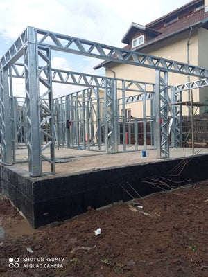 Under-Construction House with Installation of Metal Frame Wall Panels thumbnail