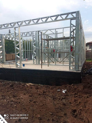 Under-Construction House with Installation of Metal Frame Wall Panels thumbnail