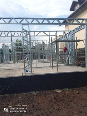 Under-Construction House with Installation of Metal Frame Wall Panels thumbnail