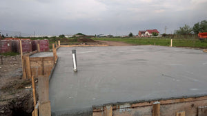 Compacting and Pouring the Foundation Slab for a Metal House thumbnail