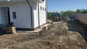 Construction of a Concrete and Wood Fence for a Metal House thumbnail