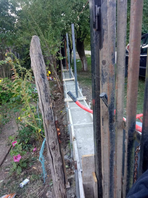 Construction of a Concrete Fence with Anthracite Gray Metal Strips, Gates, and Pedestrian Alley thumbnail