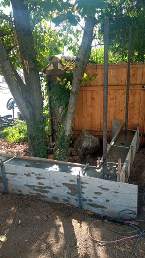 Construction of a Concrete Fence with Anthracite Gray Metal Strips, Gates, and Pedestrian Alley thumbnail