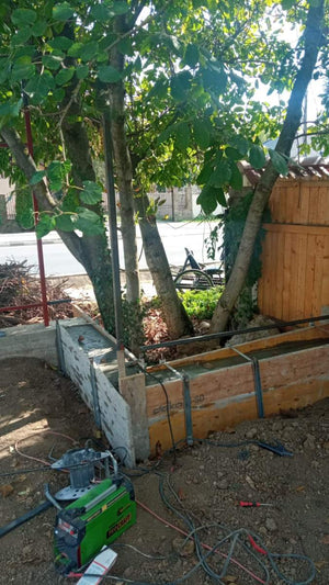 Construction of a Concrete Fence with Anthracite Gray Metal Strips, Gates, and Pedestrian Alley thumbnail