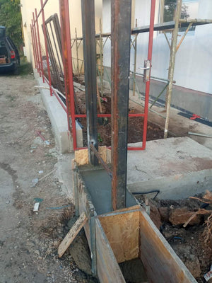 Construction of a Concrete Fence with Anthracite Gray Metal Strips, Gates, and Pedestrian Alley thumbnail