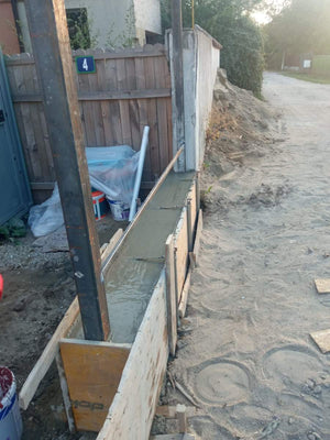 Construction of a Concrete Fence with Anthracite Gray Metal Strips, Gates, and Pedestrian Alley thumbnail