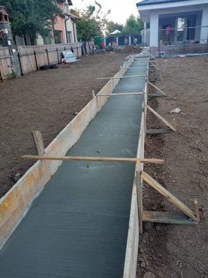 Construction of a Concrete Fence with Anthracite Gray Metal Strips, Gates, and Pedestrian Alley thumbnail