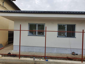 Construction of a Concrete Fence with Anthracite Gray Metal Strips, Gates, and Pedestrian Alley thumbnail