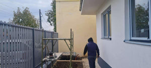 Construction of a Concrete Fence with Anthracite Gray Metal Strips, Gates, and Pedestrian Alley thumbnail