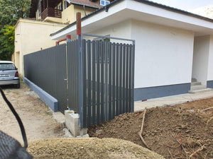 Construction of a Concrete Fence with Anthracite Gray Metal Strips, Gates, and Pedestrian Alley thumbnail