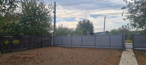 Construction of a Concrete Fence with Anthracite Gray Metal Strips, Gates, and Pedestrian Alley thumbnail