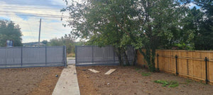 Construction of a Concrete Fence with Anthracite Gray Metal Strips, Gates, and Pedestrian Alley thumbnail