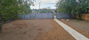 Construction of a Concrete Fence with Anthracite Gray Metal Strips, Gates, and Pedestrian Alley thumbnail