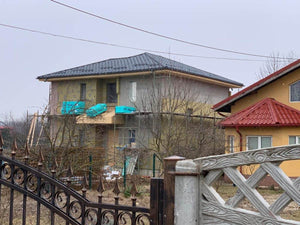 Installation of Metal Tile Roofing on a Two-Story House thumbnail