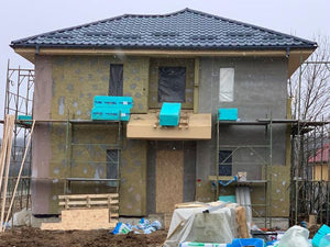 Installation of Metal Tile Roofing on a Two-Story House thumbnail