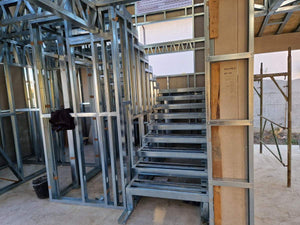 Installation of a Metal Staircase with 2 Ramps, a Landing, and a Slab Between Levels thumbnail