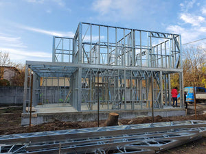 Installation of Metal Frame for a House Equipped in Gold thumbnail