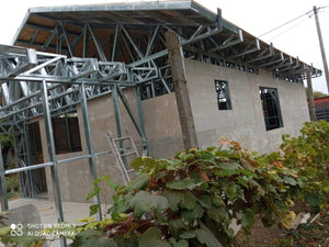 Exterior Cladding with Fiber Cement for a Single-Story Metal House with a Covered Terrace thumbnail