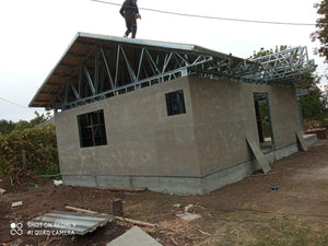 Exterior Cladding with Fiber Cement for a Single-Story Metal House with a Covered Terrace thumbnail