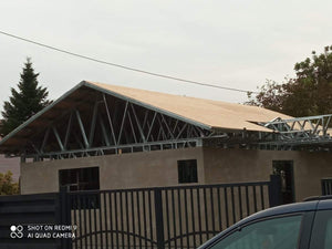 Exterior Cladding with Fiber Cement for a Single-Story Metal House with a Covered Terrace thumbnail