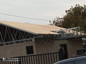 Exterior Cladding with Fiber Cement for a Single-Story Metal House with a Covered Terrace thumbnail