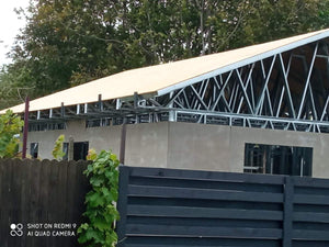 Exterior Cladding with Fiber Cement for a Single-Story Metal House with a Covered Terrace thumbnail