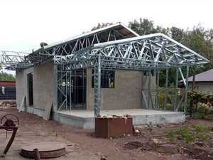 Exterior Cladding with Fiber Cement for a Single-Story Metal House with a Covered Terrace thumbnail