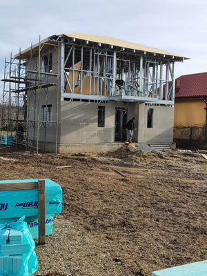 Exterior Cladding with Fibercement for a Metal House with a 162 sqm Area thumbnail