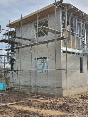 Exterior Cladding with Fibercement for a Metal House with a 162 sqm Area thumbnail
