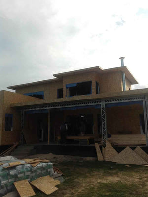 Wall and Roof Cladding with 15mm OSB for a 250 sqm Model House thumbnail