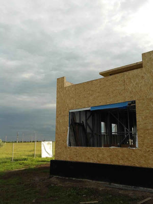 Wall and Roof Cladding with 15mm OSB for a 250 sqm Model House thumbnail