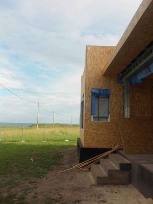 Wall and Roof Cladding with 15mm OSB for a 250 sqm Model House thumbnail