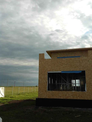 Wall and Roof Cladding with 15mm OSB for a 250 sqm Model House thumbnail