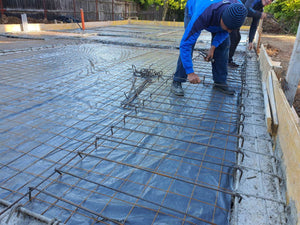 Placing Steel Plates at Ground Level for a Single-Story House Under Construction thumbnail